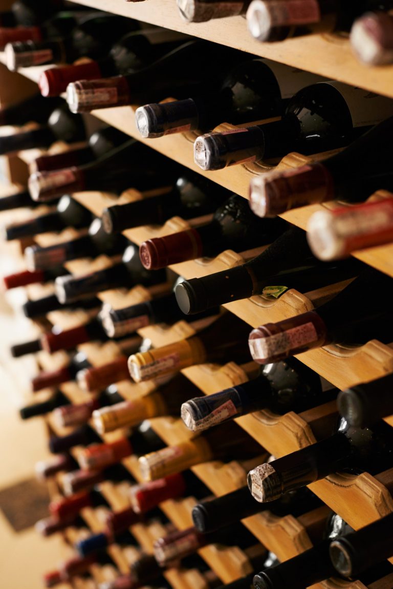 bottles of wine stored in wooden wine rack 2026 01 09 11 02 39 utc 1 scaled.jpg